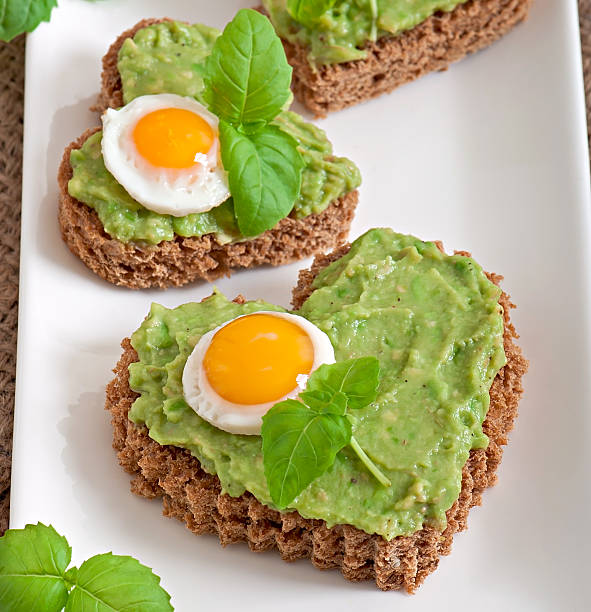 Sandwich with avocado paste and egg