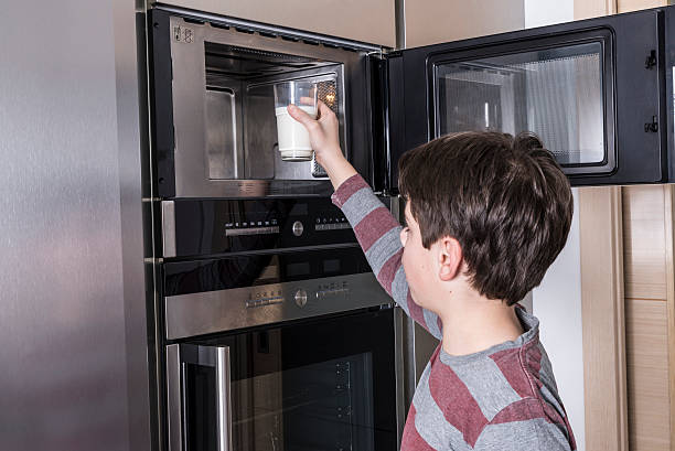 istock Child preparing a glass of milk 533050879