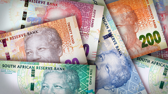 South African Rand bills creating a colorful background