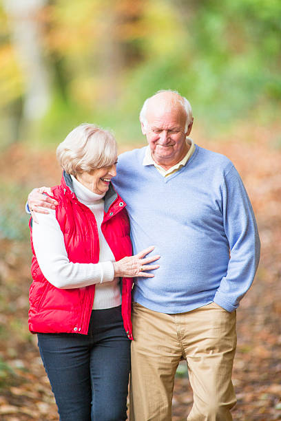 istock Senior Couple Walking Through the Woods 533051545