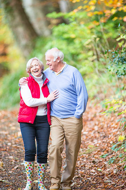 istock Senior Couple Walking Through the Woods 533051549