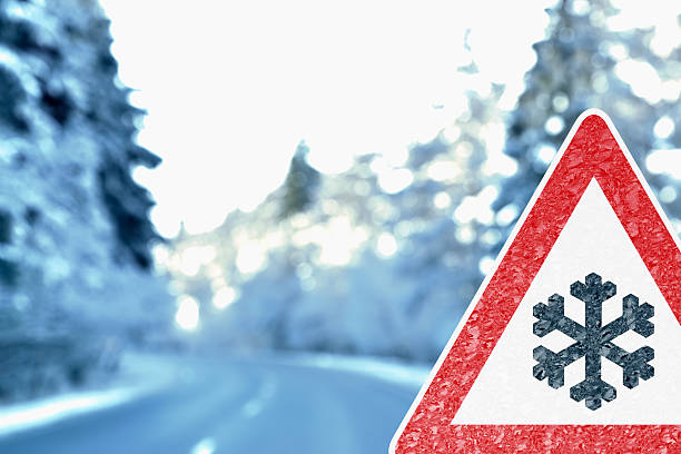 istock Abstract Winter Driving Background with Warning Sign 533051593