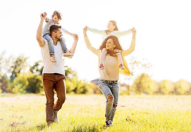 istock Young family playing outdoors. 533052261