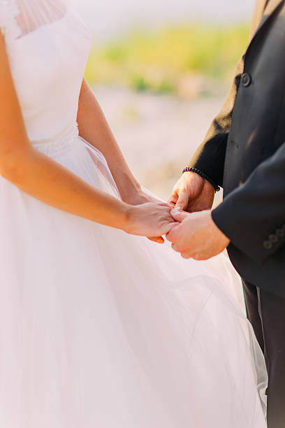 istock Image of bride and groom holding hands somewhere outside 533052314