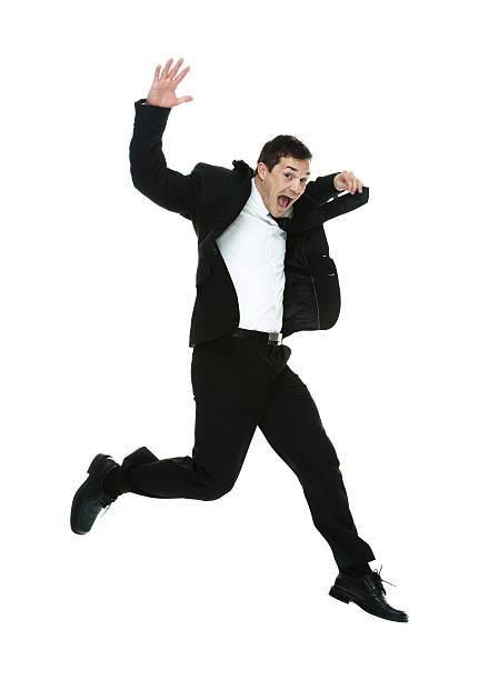 istock Excited businessman jumping & looking at camera 533052579