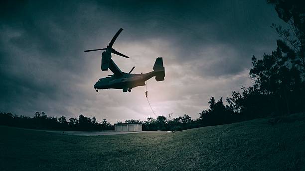 Solider repelling out of military plane.