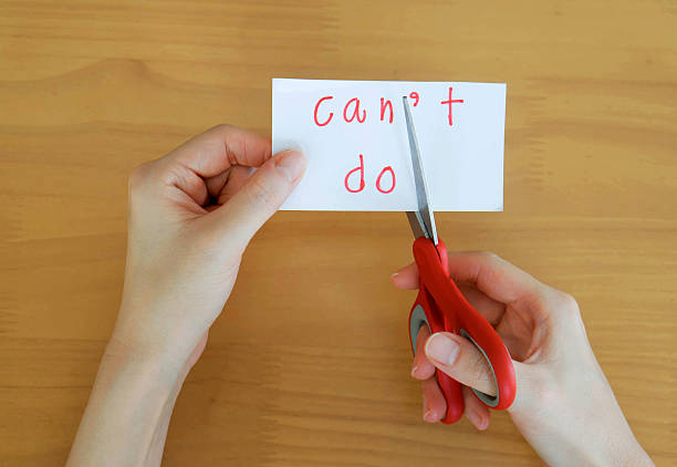 istock holds card with text can't do on wood plate 533053528