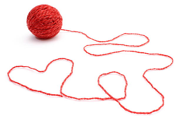 istock Heart shape and wool ball on white background 533053959