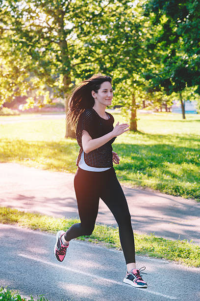istock Woman runner outside jogging 533053968