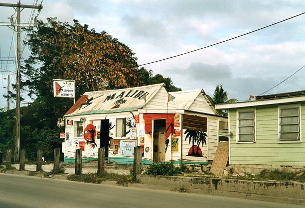 Saint Lawrence, Barbados - February 27, 2006: Picturesque Malibu tin shack on a road to Saint Lawrence Gap, the most touristy and nightlife spot in Barbados.