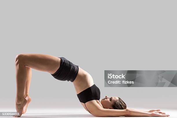 Yogi Gymnast Girl Doing Exercise For Spine Stock Photo - Download Image Now - Bending Over Backwards, Girls, Teenage Girls