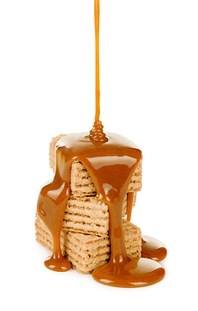 istock sweet caramel sauce is poured on a waffle cookies 533055607