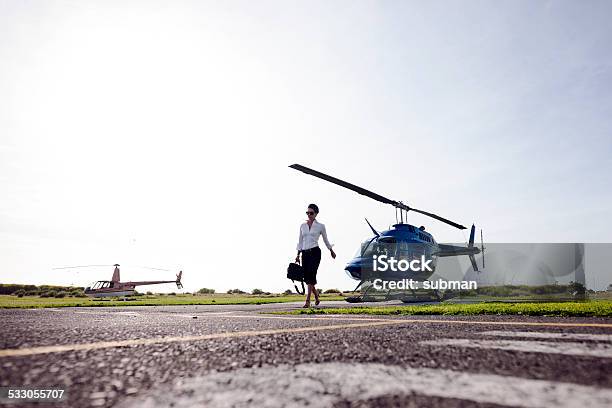 Confident Successful Stock Photo - Download Image Now - Helipad, Helicopter, One Woman Only