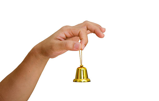 istock hand and Christmas bell isolated on white background 533058096