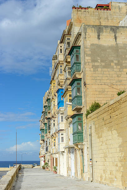 House with balconys on Malta at seaside stock photo