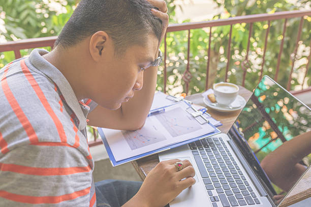 istock Young Asian businessman feels headache with problems on laptop 533058714