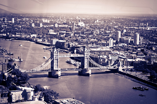 Scenic aerial view of London, over the river Thames towards Canary Wharf and Eastern London