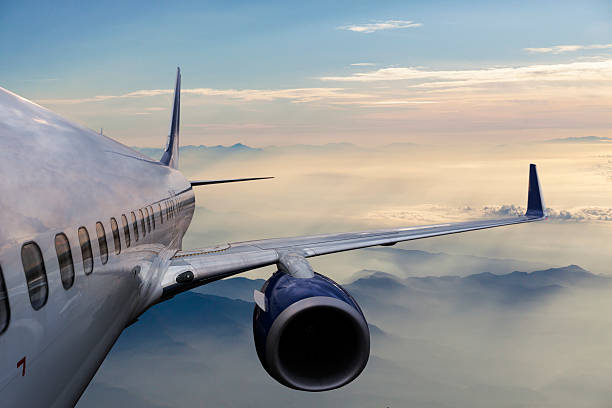 istock Body of an Airplane Flying Above Clouds 533059544