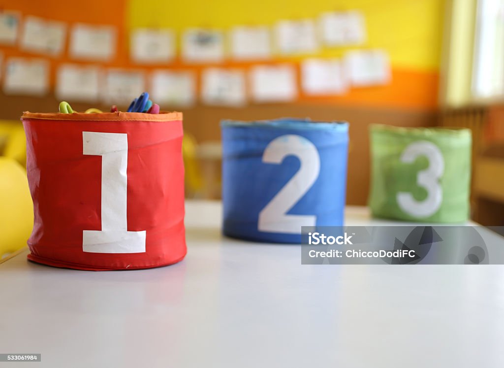 Three jars colored Red Green and blue Three jars colored Red Green and blue with written one two and three in the kindergarten classroom Baby - Human Age Stock Photo