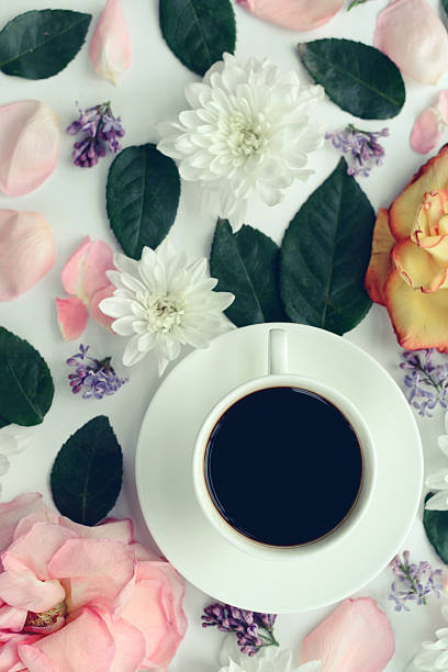 istock flower background and cup of coffee ,composition flat lay 533062660