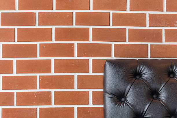 Brick wall and Sofa stock photo