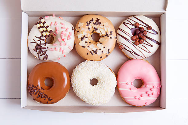 kolorowe donuts - glazed almond nut sugar zdjęcia i obrazy z banku zdjęć