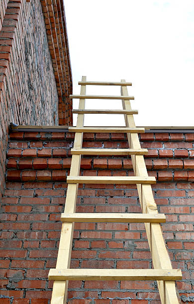 istock Wooden stairs on a brick wall 533064836