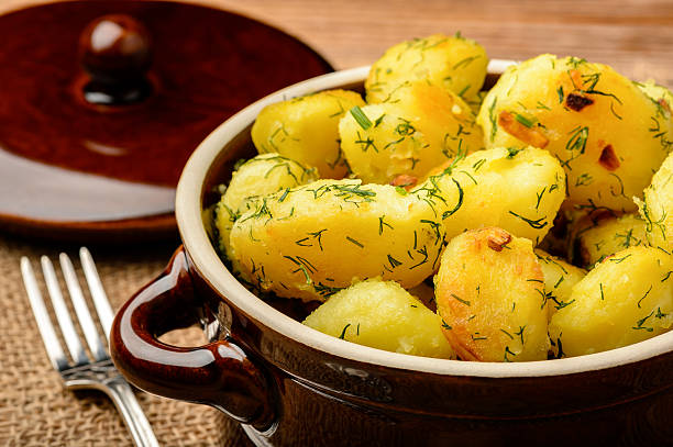 istock Roasted young potatoes with garlic and dill. 533067192