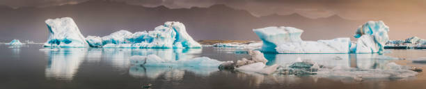 istock Icebergs creaking in Arctic ocean lagoon beneath sunset storm Iceland 533067866