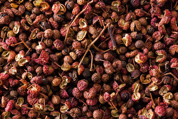 heap of sichuan, japanese pepper a heap of sichuan, japanese pepper on dark background sichuan province stock pictures, royalty-free photos & images