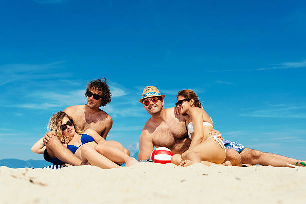 istock Two couples spending sunny day at beach in summer 533070752