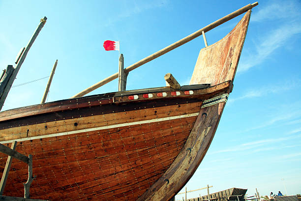 Traditional wooden dhow with bahraini flag