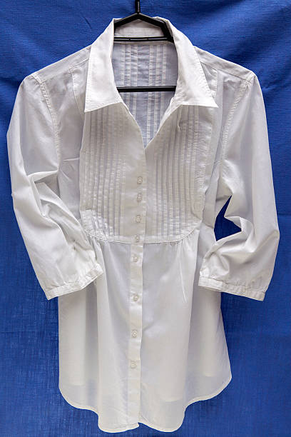istock White cotton blouse on a hanger 533099097