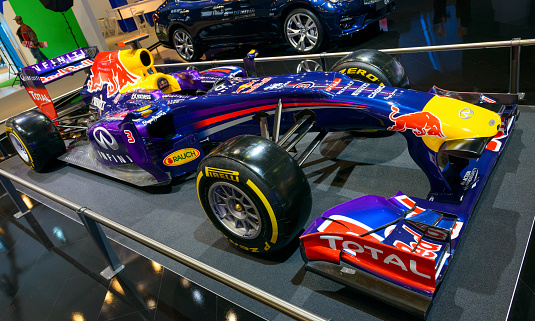 Brussels, Belgium - January 15, 2015: Infiniti Red Bull Racing F1 race car on display during the 2015 Brussels motor show. People in the background are looking at the cars.