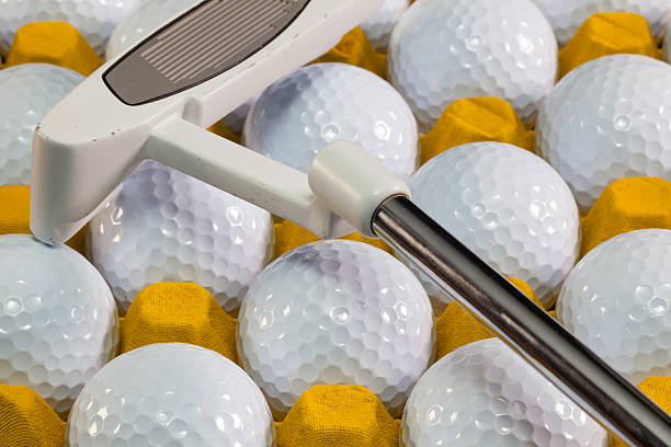 istock White golf balls in the yellow box 533150763
