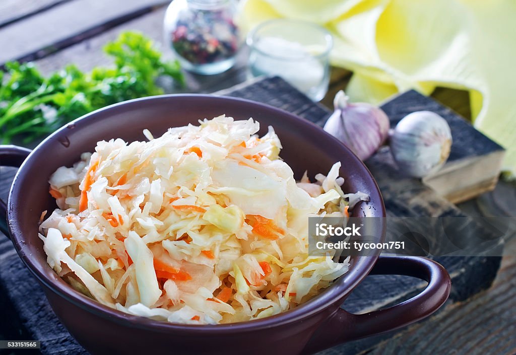 sauerkraut sauerkraut salad in the bowl and on a table 2015 Stock Photo