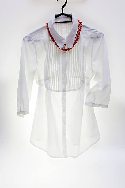 istock White cotton blouse on a hanger 533151845
