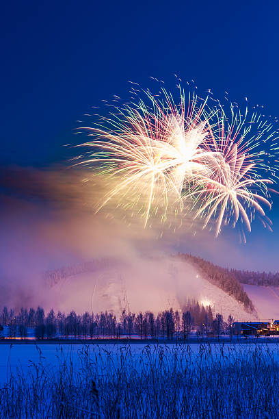 Fireworks in blue winter sky stock photo