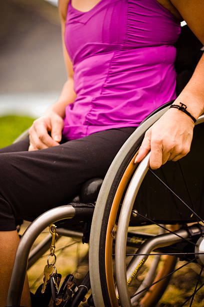 Wheelchair woman outdoors stock photo