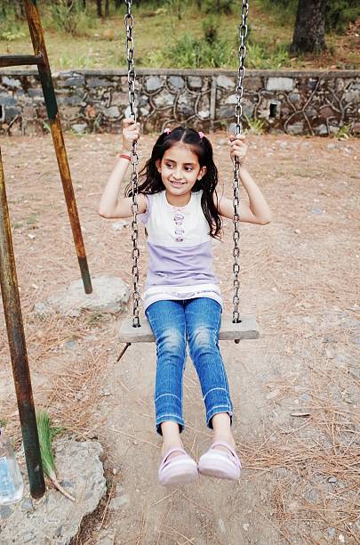 istock Little girl on swing 533153797