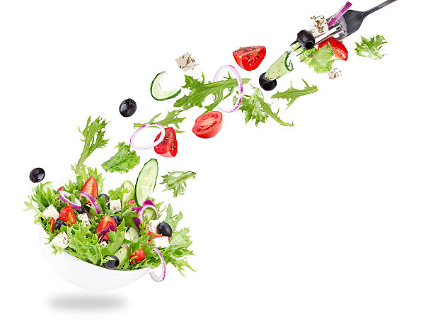 istock Fresh salad with flying vegetables ingredients 533172809