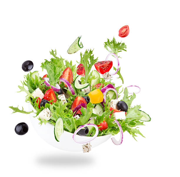 istock Fresh salad with flying vegetables ingredients 533172825