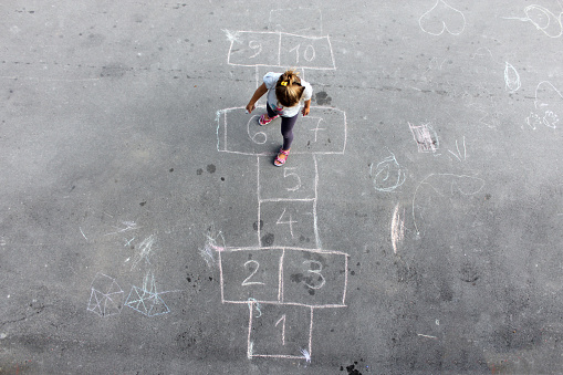 Girl on the hopscotch