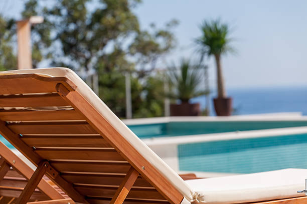 istock Luxury swimming pool and deck chair 533177717