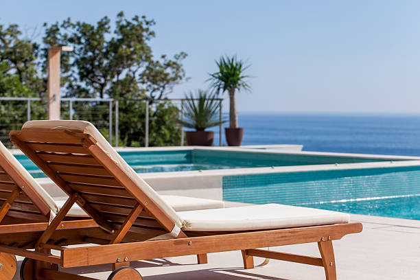 istock Luxury swimming pool and deck chair 533177719