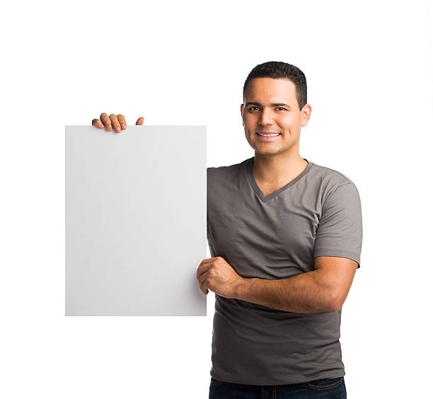 istock Happy man holding placard 533178843