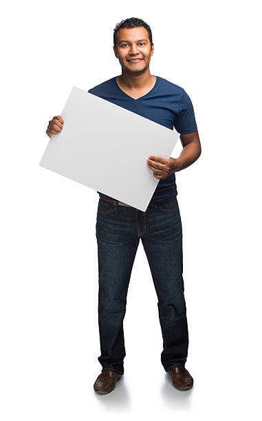 istock Young man holding sign 533178867