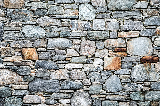 textura de piedra de la pared - pared de piedra fotografías e imágenes de stock