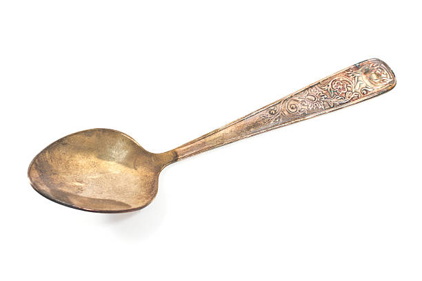 istock Vintage silver tea spoon isolated on white 533179339