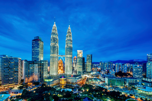 A cityscape with Petronas towers of the downtown area of Kuala Lumpur, capital city of Malaysia